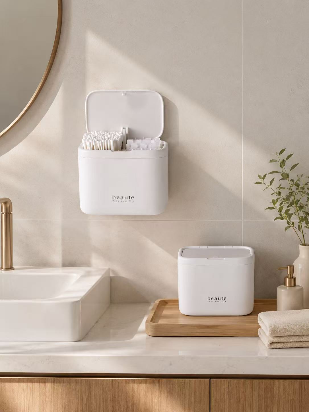 Wall-mounted and countertop cotton swab organizer in a bright bathroom