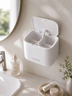 Open white cotton swab organizer showing four divided compartments