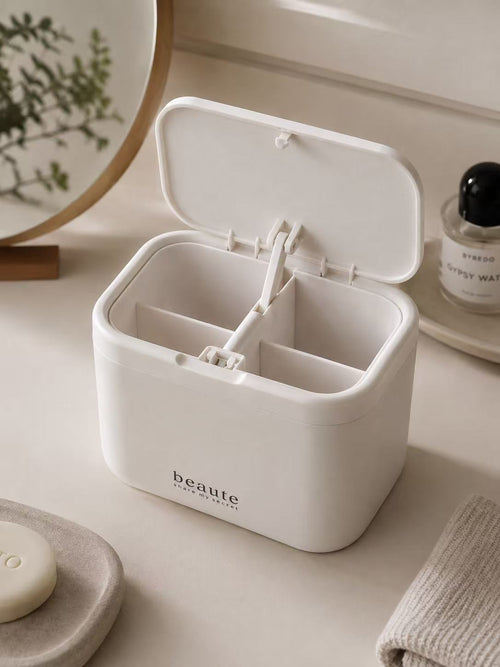 White wall-mounted cotton swab and pad organizer with lid open and four compartments