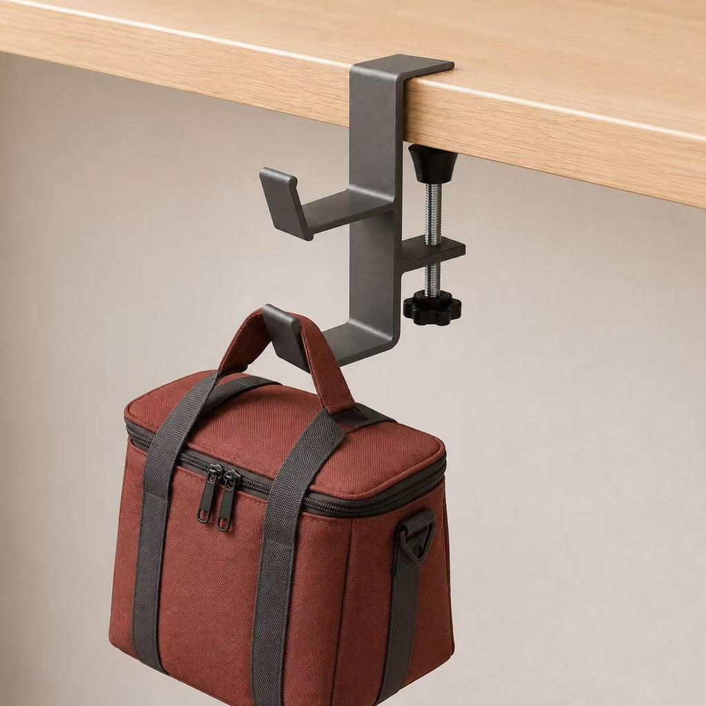 Dual-hook desk clamp holding a handled bag