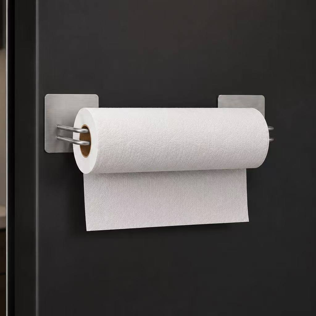 Silver two-piece magnetic paper towel holder on a black refrigerator