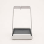 Front view of white multifunctional kitchen countertop stand with gray drip tray