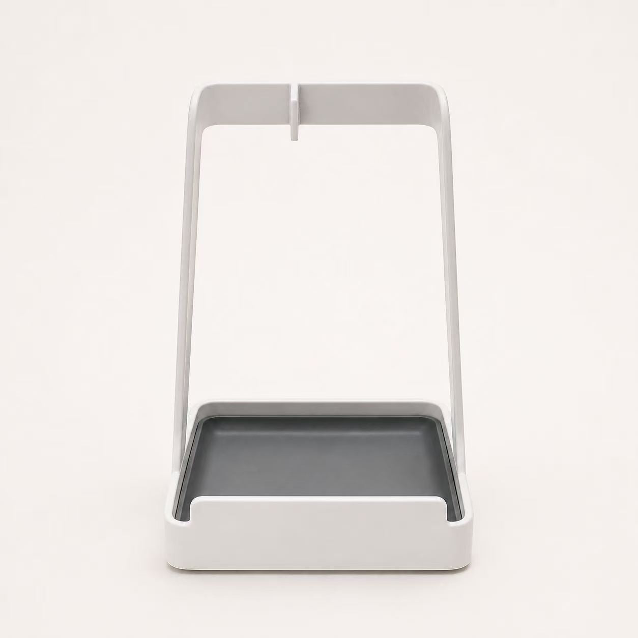 Front view of white multifunctional kitchen countertop stand with gray drip tray