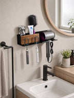 Compact black wall-mounted bathroom organizer with two toothbrush holders and a hair dryer bracket